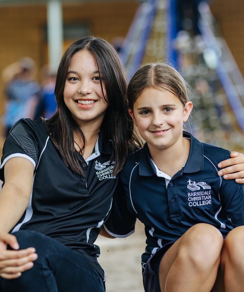 Young students at Bairnsdale Christian College exploring a light experiment in an interactive learning approach.