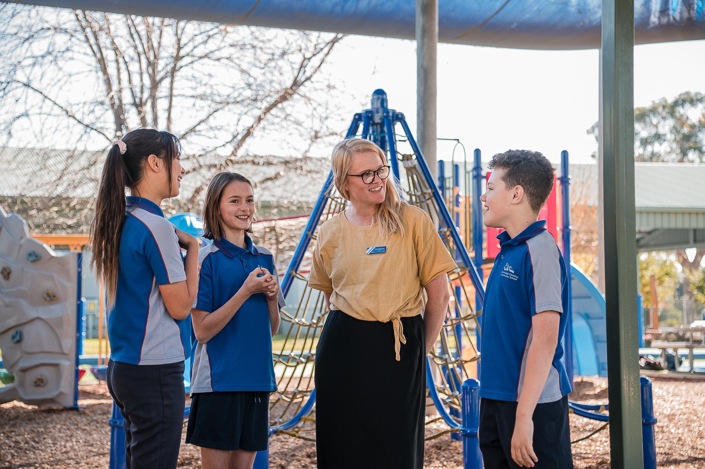 Close up of a smiling student on a playground, who is well known and nutured by the community at Bairnsdale Christian College.